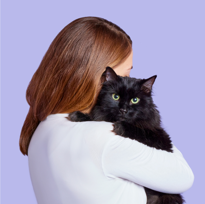 woman holding cat